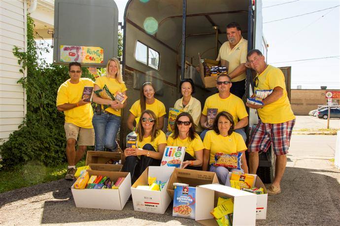 FELRC staff drop off food donations to COPE.