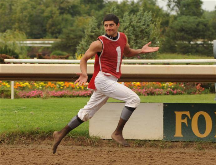 Rider Bryce Alderson wins jockey foot race. 